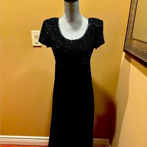 Adrianna Papell evening gown.  Bodice has sequins, bottom has polyester shell.